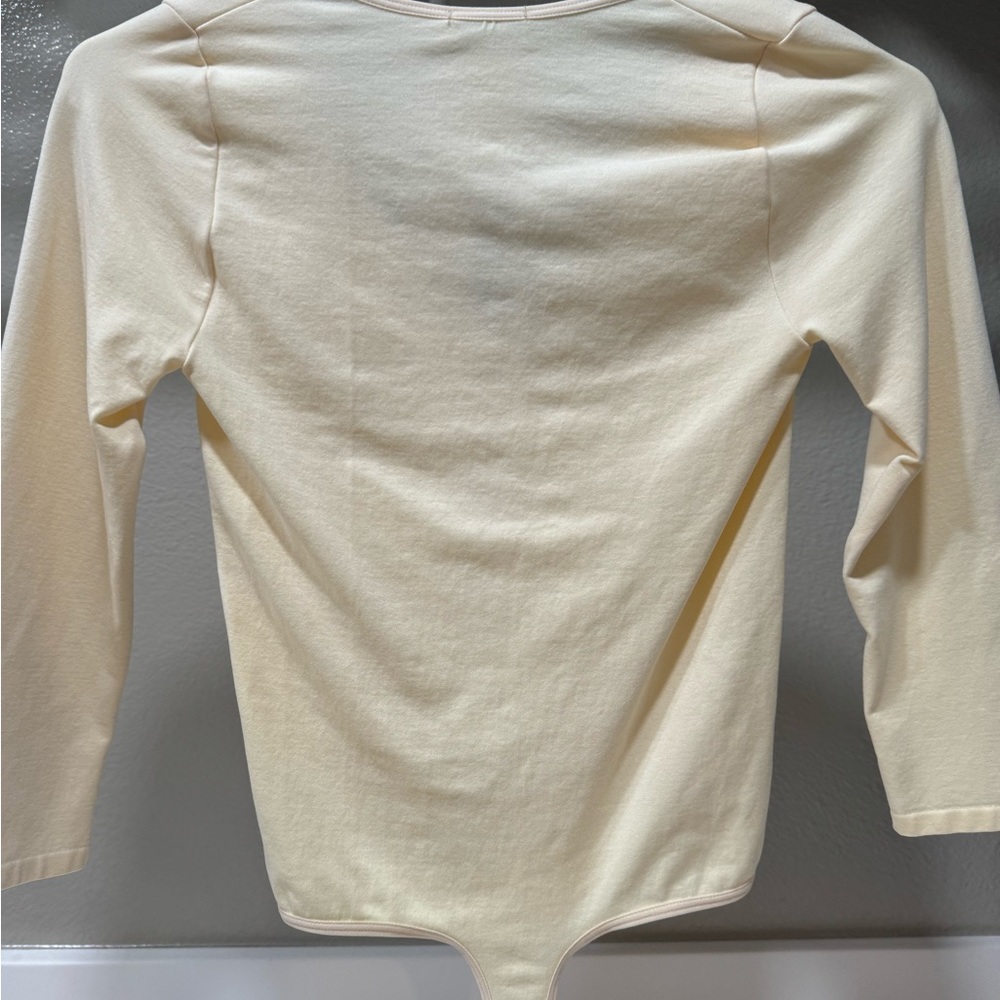 Bebe peach colored body suit